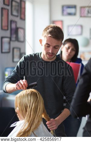 Keune Brand Technologist Artem Raychuk Dyes The Hair Of A Model On Advertising Workshop