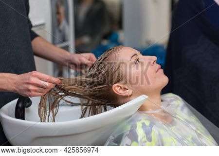 Keune Brand Technologist Artem Raychuk Dyes The Hair Of A Model On Advertising Workshop