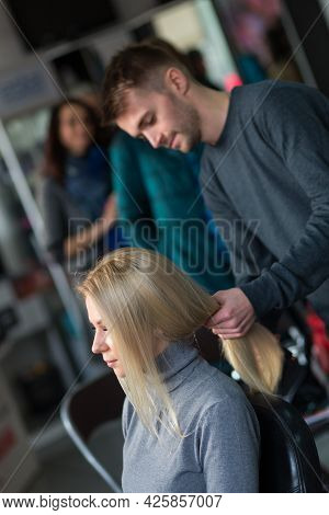 Keune Brand Technologist Artem Raychuk Dyes The Hair Of A Model On Advertising Workshop