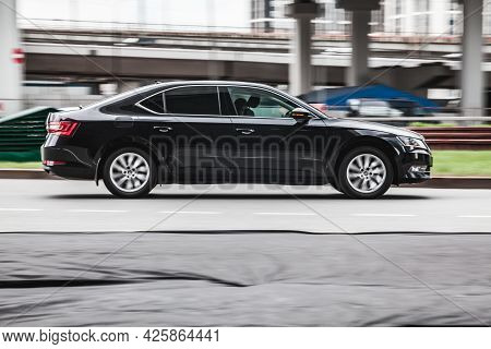Moscow, Russia - May 2021: Fast Moving Skoda Superb B8 On The City Road. Black Sedan Rides On Street