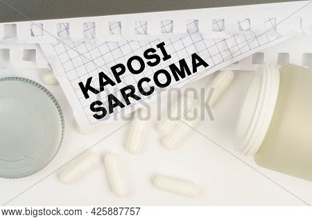 Medicine And Health Concept. On The Table Is An Open Jar Of Pills And A Sheet Of Paper With The Insc