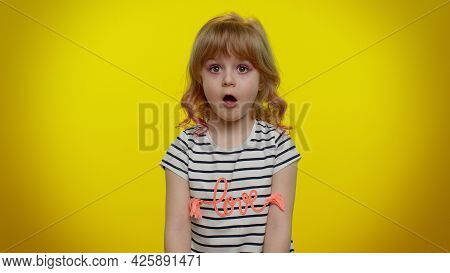 Oh My God, Wow. Excited Amazed Blonde Child Girl 5-6 Years Old Raising Hands In Surprise Looking At 