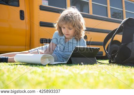 Kid Study Online With Tablet In Park. Social Distance During Quarantine, On-line Education Concept, 