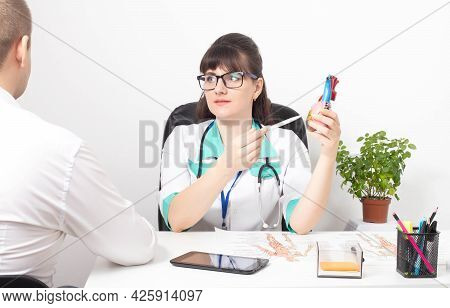 Young Patient At The Reception Of A Doctor Cardiologist-psychotherapist. The Concept Of Psychologica