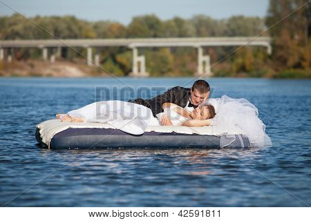 Bride And Groom Are Floating Down The River