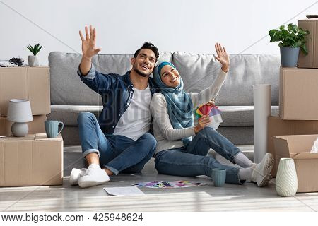 Inspired Young Couple Thinking About Design In New House