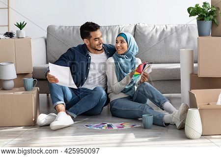 Creative Arab Family Working On Interior For New Apartment