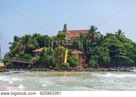 A Small Island Near The Beach By The Ocean.