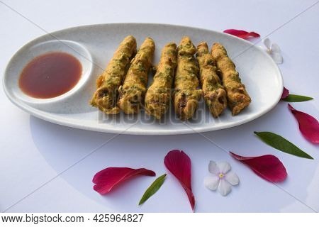 Delicious Babycorn Fritters, Indian Tea Time Snacks With Tomato Ketchup. Female Holding Serving Baby