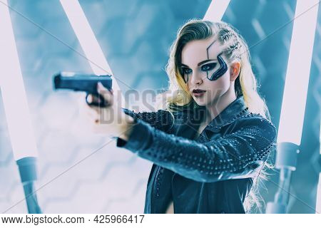 Sci-fi cyborg soldier girl. An attractive girl cyberpunk stands on alert with a gun among the neon lights. World of the future. Game, virtual reality.