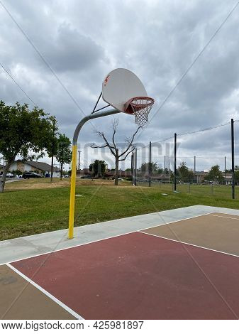 Recreational Facilities With Basketball Court In Residential Community Park In Placentia, California