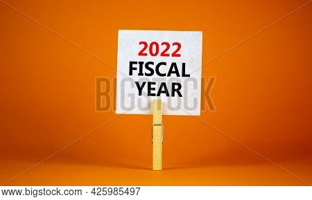 2022 Fiscal New Year Symbol. White Paper With Words '2022 Fiscal Year', Clip On Wooden Clothespin. B