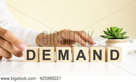 Wooden Blocks With Letters Demand On The Office Desk, Information And Communication Background