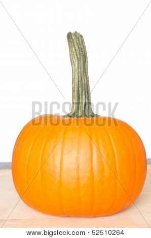 Fresh Orange Pumpkin On Wooden Cutting Board