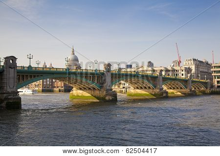 LONDON, UK - MARCH 29, 2014 South bank walk of the river Thames, View on bridge and modern archite