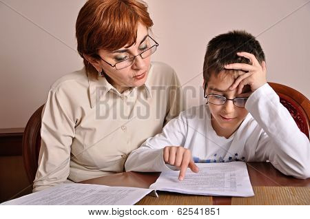 Woman and boy doing homework