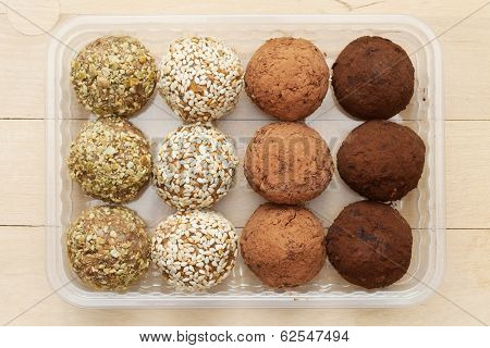 Macrobiotic Healthy Food: Balls From Ground Wheat Sprouts With Sesame, Pumpkin Seeds And Chocolate S