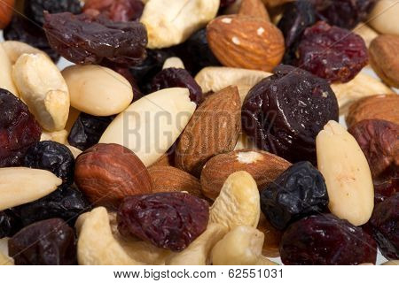 mixed nuts and dried fruits isolated on white background