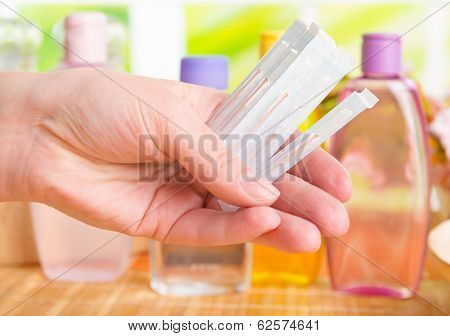 Hand holding acupuncture needles