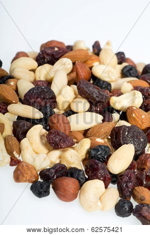 mixed nuts and dried fruits isolated on white background