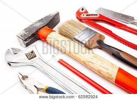 Various old used tools on white background