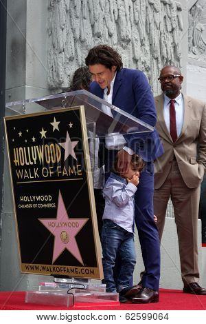 LOS ANGELES - APR 2:  Orlando Bloom, Flynn Bloom at the Orlando Bloom Hollywood Walk of Fame Star Ceremony at TCL Chinese Theater on April 2, 2014 in Los Angeles, CA