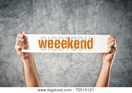 Man Holding Board With Weekend Title