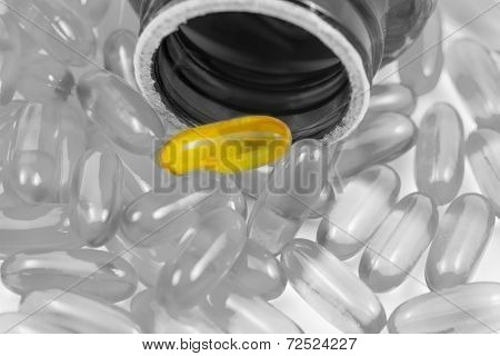 Fish Oil Pills Spilled From Container Split Tone