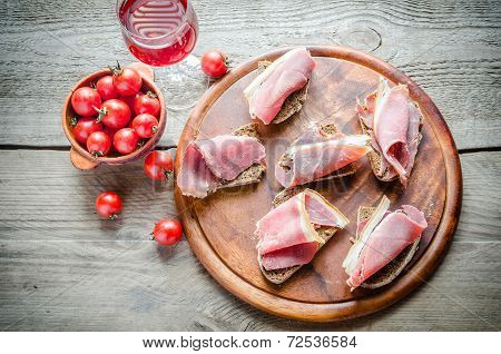 Sandwiches With Italian Ham On The Wooden Board