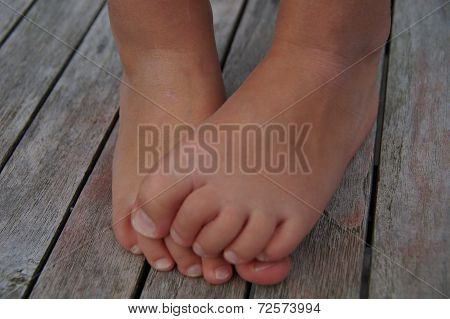Cute shy child feet