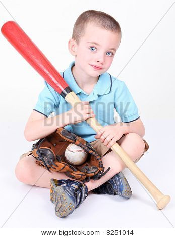 Young Boy Holding A Baseball Bat With Ball And Glove