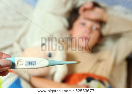 Sick Preteen Boy In Bed With Termometer Show High Temperature