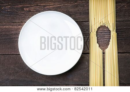 Spoon shape made of pasta and white dish