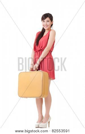 Asian traveling woman with portmanteau, full length portrait with reflection on studio white background.