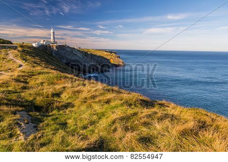 Walking along the cliff overlooking the Bay of Biscay to the faro of Santander