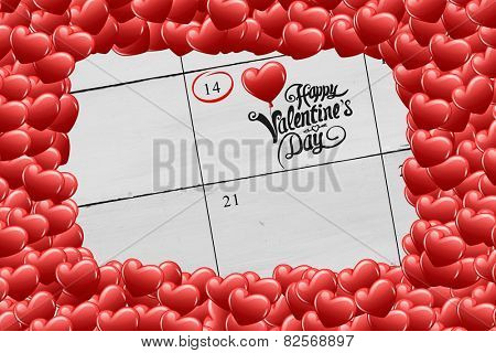 Red love hearts against calendar