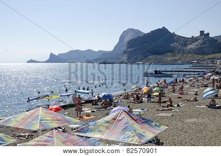 Tourists On The Beach In Sudak In The Crimea