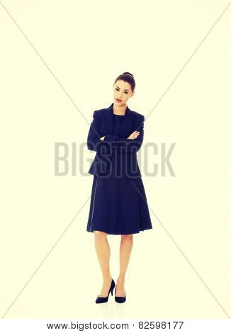 Anoyed and displeased businesswoman standing