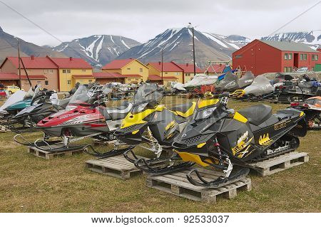 View to the snowmobiles parked outside for a short arctic summer in Longyearbyen, Norway.