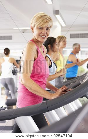 Woman On Running Machine In Gym