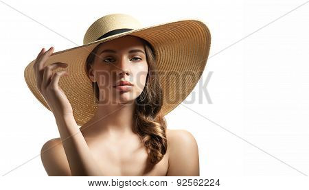 Young woman in summer straw hat