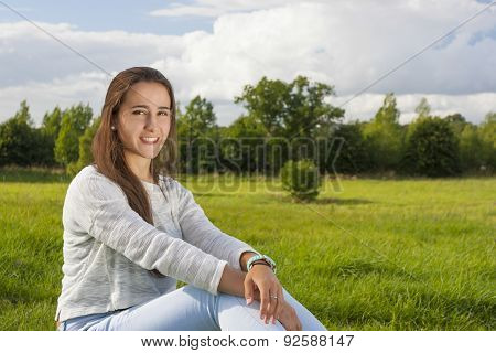 Beautiful Teenager On The Grass