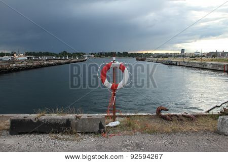 Lifebuoy Near Water Canal In Harbour