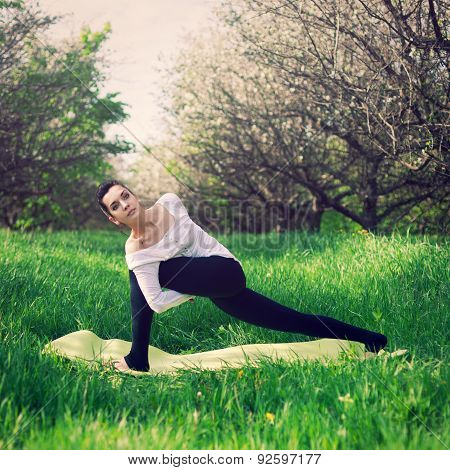 Beautiful Girl Is Engaged In Yoga In The Forest