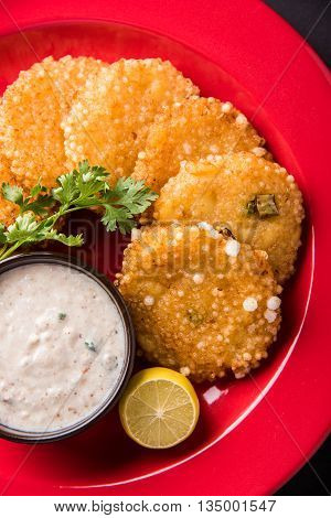 tasty sabudana vada or sabudana vade made up of Sago served with peanut chutney, a famous fasting recipe or snack from maharashtra, India
