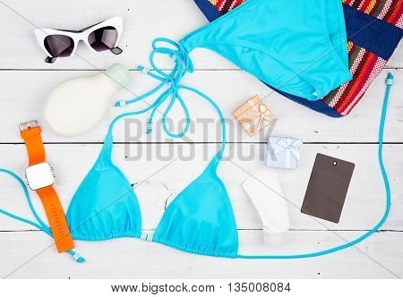 Summer Women's Fashion With Blue Swimsuit, Bag, Sunglasses, Sunscreen, Watch, Gift Boxes And Tag On 