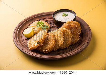 tasty sabudana vada or sabudana vade made up of Sago served with peanut chutney, a famous fasting recipe or snack from maharashtra, India