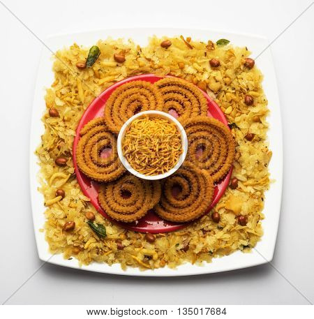 design created using diwali food or diwali snacks, chivda or chiwda, chakali or chakli, besan sev, front angle closeup