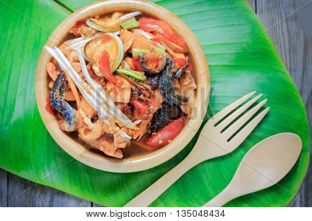 santol salad in wooden bowl top view