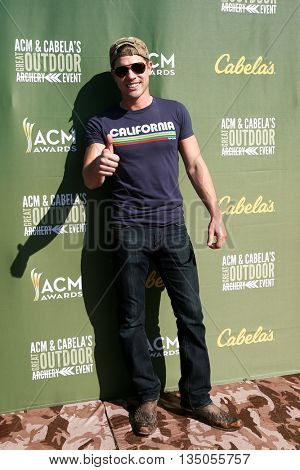 ARLINGTON, TX - APR 18: Dustin Lynch attends the ACM & Cabela'??s Great Outdoor Archery Event during the 50th Academy Of Country Music Awards at the Texas Rangers Youth Ballpark on April 18, 2015.